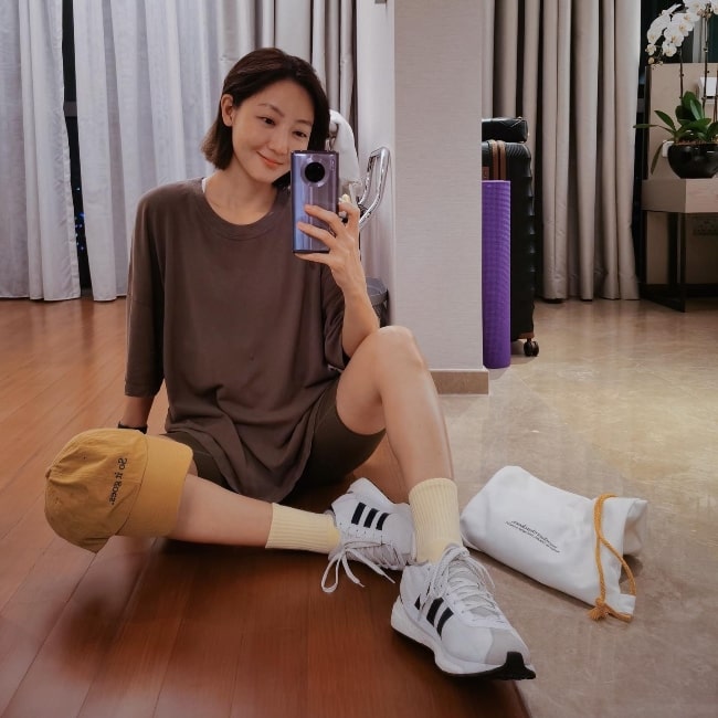 Jojo Goh as seen smiling in a mirror selfie in Singapore in 2021
