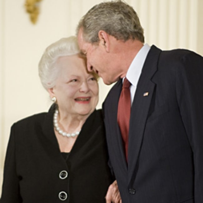 Olivia de Havilland pictured while receiving the National Medal of Arts from President George W. Bush in November 2008