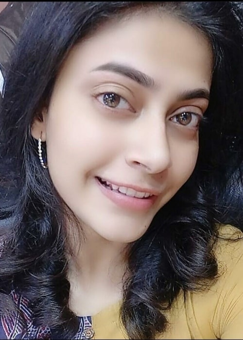 Parvathy Nambiar as seen while smiling for a picture