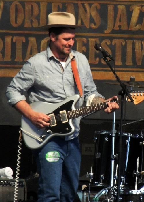Eric Lindell as seen in a picture that was taken during a live performance at the New Orleans Jazzfest in 2012