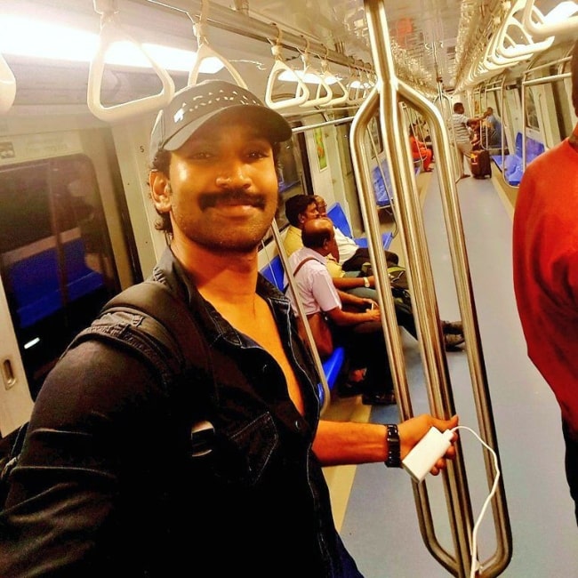 Aadhi Pinisetty smiling while traveling in Chennai Metro for the first time in April 2017