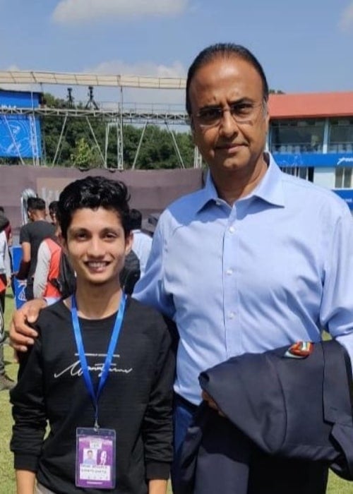 Charu Sharma, posing with an event volunteer, in February 2020