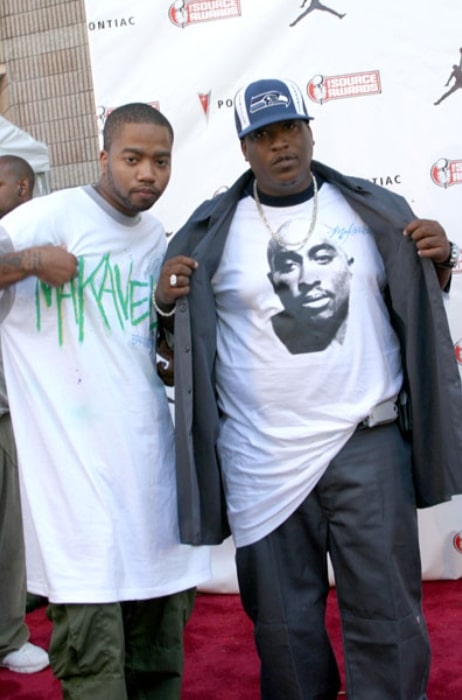 E.D.I. Mean (Right) posing for the camera alongside rapper Kastro