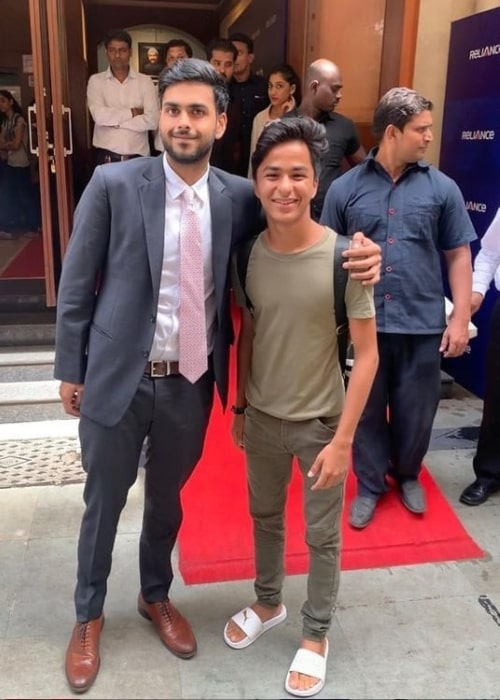 Jai Anshul Ambani posing with a fan in July 2019