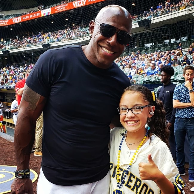 Liamani Segura as seen in a picture with football wide receiver Donald Driver in August 2021, at the American Family Field