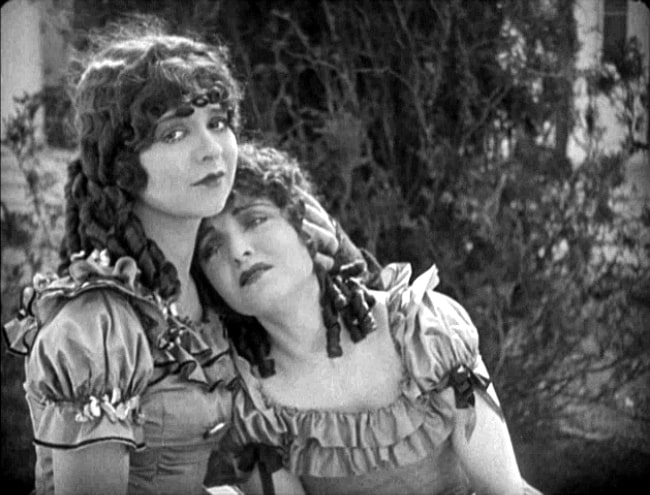 Clara Bow (Left) comforting Ethel Shannon in 'Maytime' (1923)