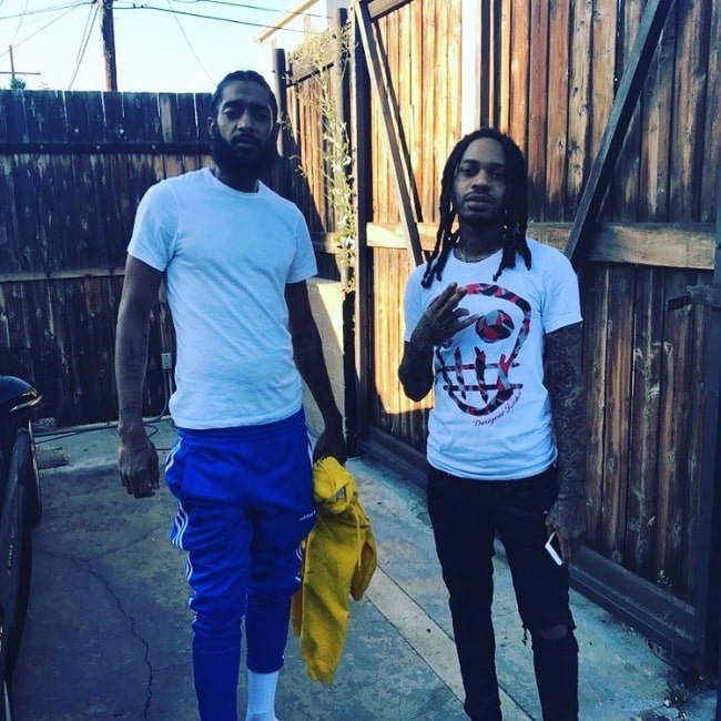 Valee (Right) posing for a picture alongside rapper Nipsey Hussle