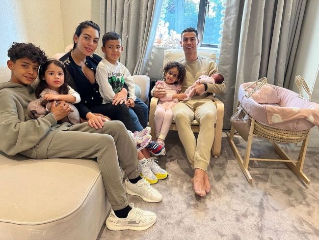 Cristiano Ronaldo Jr. (left) as seen with his family in 2022