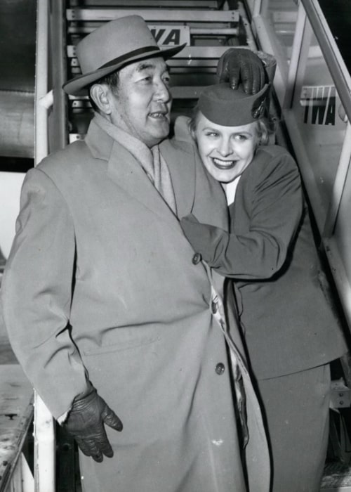 Sessue Hayakawa pictured with a flight attendant in New York, c. 1960