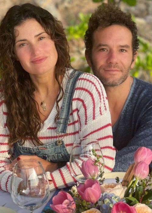Aaron Lohr as seen while posing for the camera alongside Idina Menzel in Puerto Vallarta, Mexico in 2022