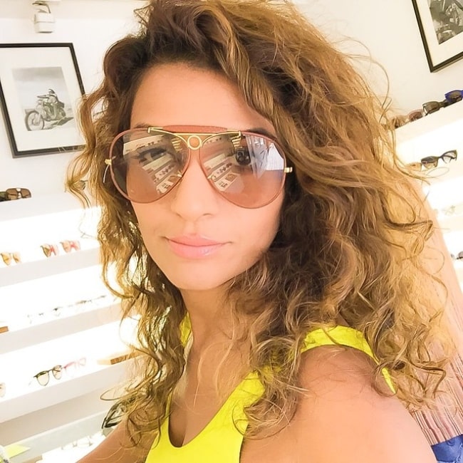 Nadia Ali as seen while trying on a pair of shades at Brentwood Country Mart in Los Angeles, California in 2015