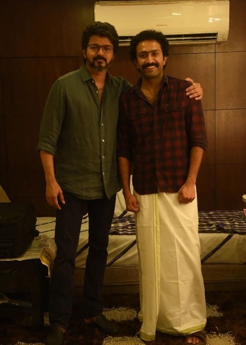 Shine Tom Chacko (Right) smiling in a picture alongside actor Vijay in 2022