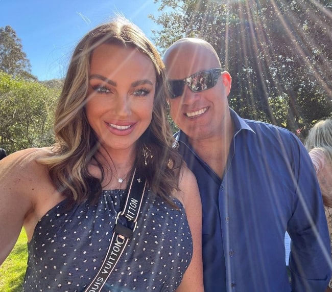 Amber Nichole Miller smiling in a selfie with Tito Ortiz in Sebastopol, California in May 2022