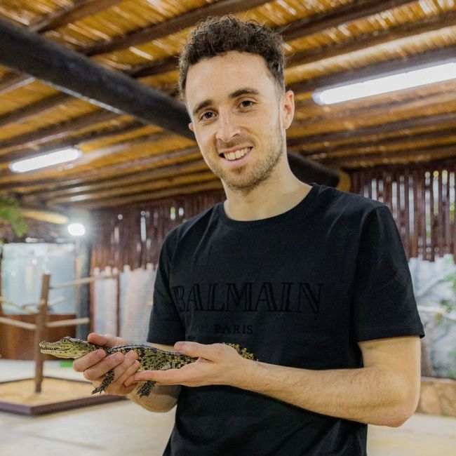 Diogo Jota seen holding a baby alligator in Dubai in 2022