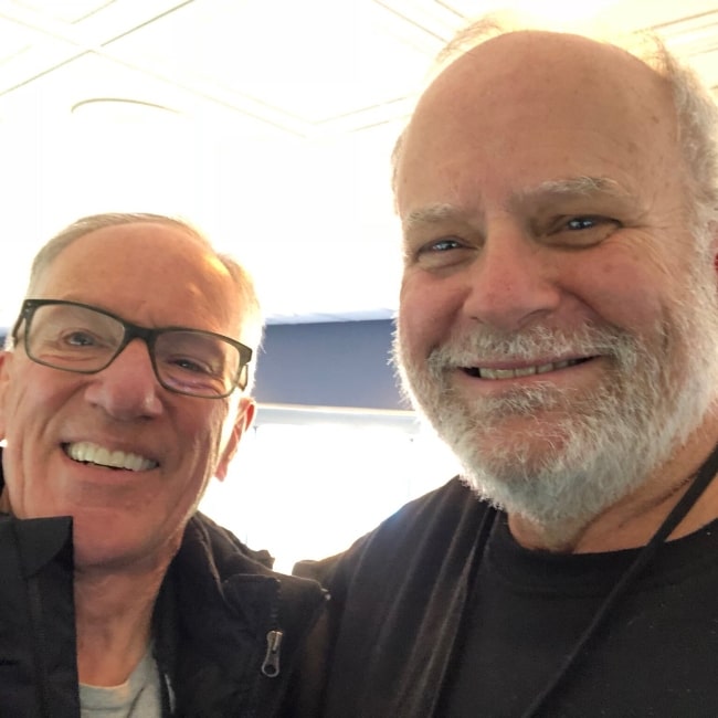 Ron Cook as seen in a selfie with sports commentator Mike Emrick at a baseball match in Pittsburgh in April 2019