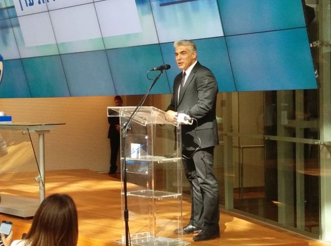 Yair Lapid as seen on the first trading day in the TASE building in 2014