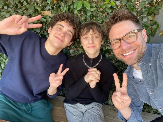 From Left to Right - Joshua Bassett, Rueby Wood, and Tim Federle as seen while smiling for a picture in February 2022