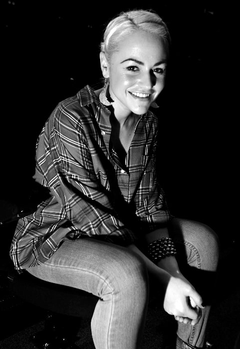 Jaime Winstone as seen while smiling in a black-and-white picture in 2010