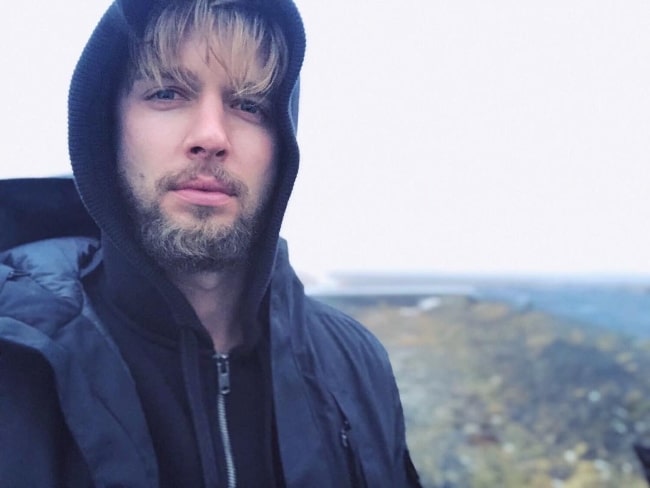 Drew Van Acker taking a selfie in Reykjavík, Iceland in January 2019