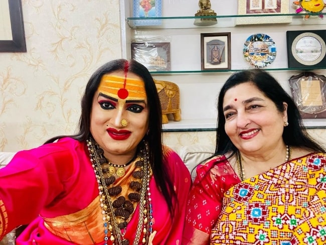 Laxmi Narayan Tripathi (Left) as seen while smiling for a picture with singer Anuradha Paudwal in November 2021