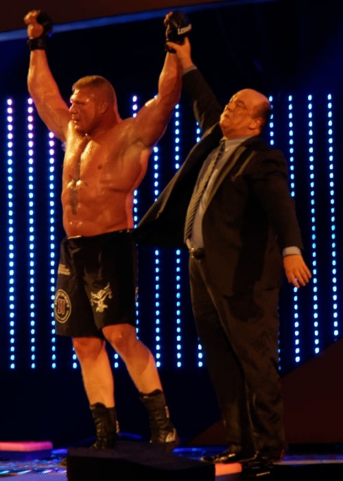 Paul Heyman as seen in a picture raising the hand of Brock Lessner in April 2014