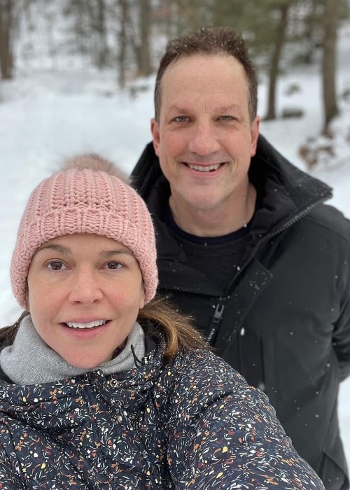 Ted Griffin and Sutton Foster smiling for a selfie while enjoying their time in the snow in January 2022