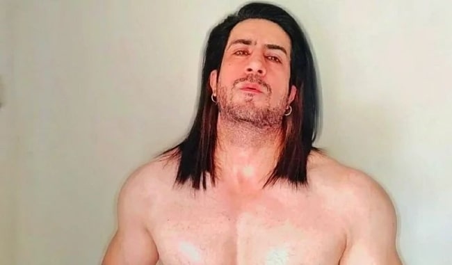 Dinesh Mehta as seen while posing shirtless for a picture in May 2022