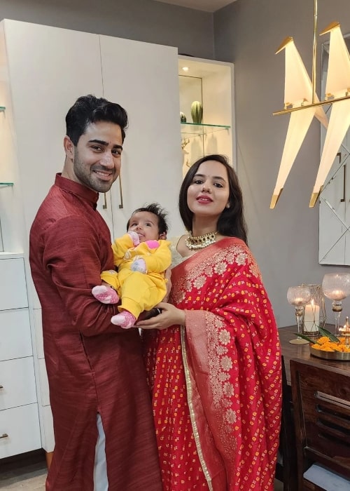 Naveen Pandit as seen in a picture with his wife Shubhi Choudhary in and their baby in October 2022