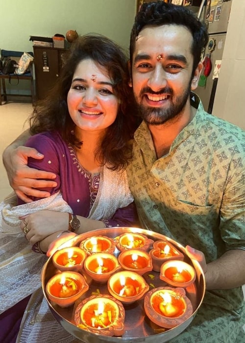 Vishal Vashishtha smiling for a Diwali picture with Deepakshi Mishra in November 2020