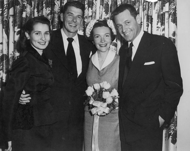 (From left to right) Brenda Marshall, Ronald Reagan, Nancy Reagan, and William Holden seen at the Reagan wedding in 1952