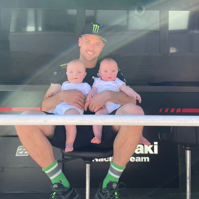 Alex Lowes as seen in a picture with his twin children in June 2022, at the Misano World Circuit