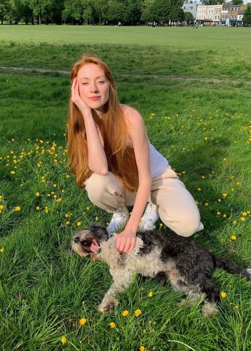 Alina Kovalenko as seen in a picture with her dog in June 2022