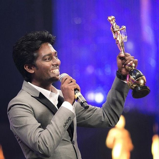 Atlee seen holding his award at the Vijay Awards in 2014