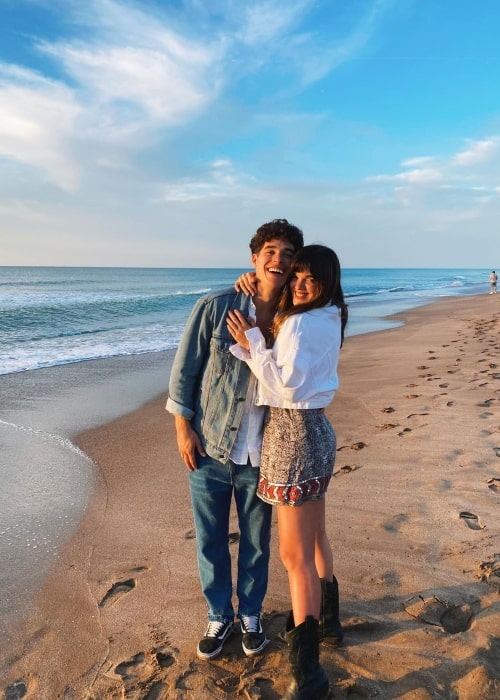 Malena Ratner smiling for a picture with Jose Gimenez Zapiola at a beach in Necochea, Argentina in January 2022