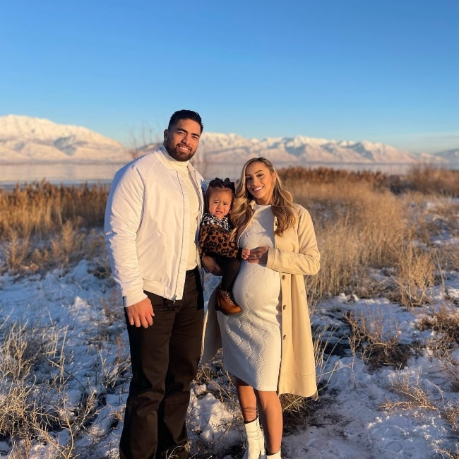 Manti Te'o as seen in a picture with his wife Jovi Nicole and their child in December 2022, in Lehi, Utah