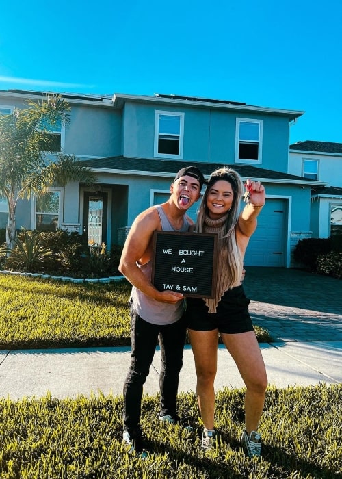 Taynara Melo Guevara as seen in a picture with her beau Samuel Guevara in front of their new home in December 2022