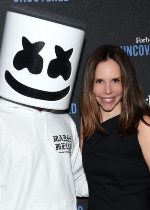 Moira Forbes posing with DJ Marshmello in November 2018