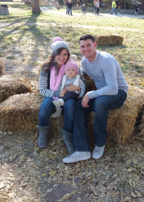Brett Maher as seen in a picture with his wife Jenna Maher and their child Maela in October 2015