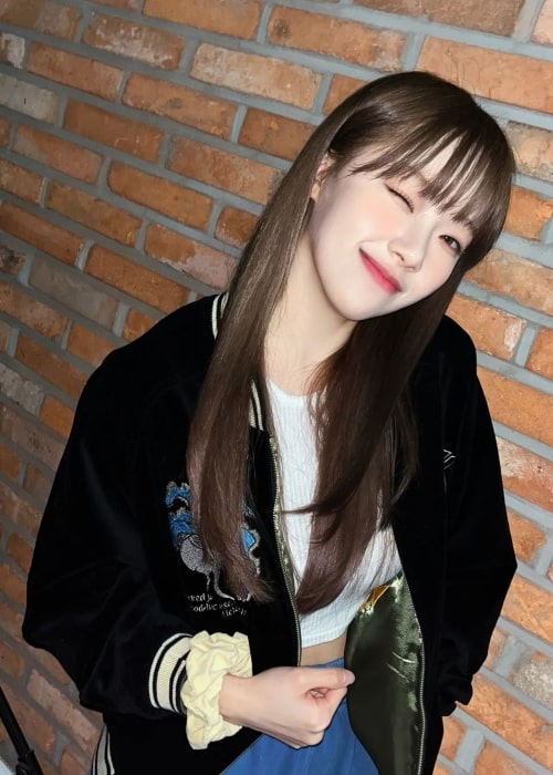 Jeewon as seen while smiling for a picture in March 2023