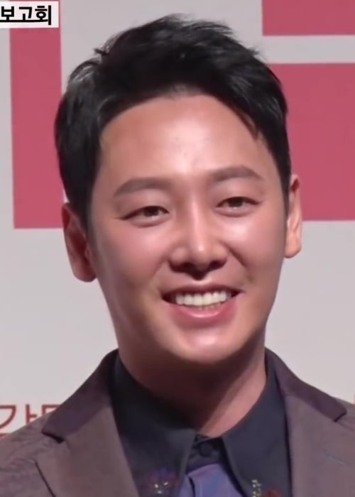 Kim Dong-wook as seen while smiling for the camera at the 'Trade Love' conference in 2019
