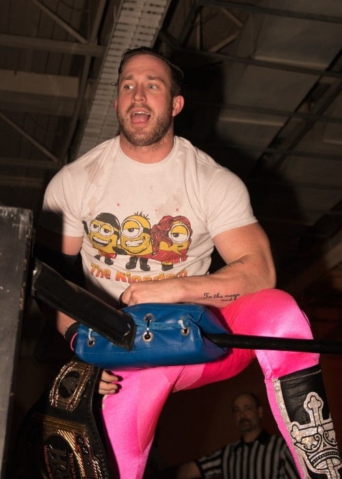 Ring of Honor wrestler Michael Bennett at a Smash Wrestling show in Etobicoke, ON, with the Ring of Honor Tag Team Championship belts in October 2015