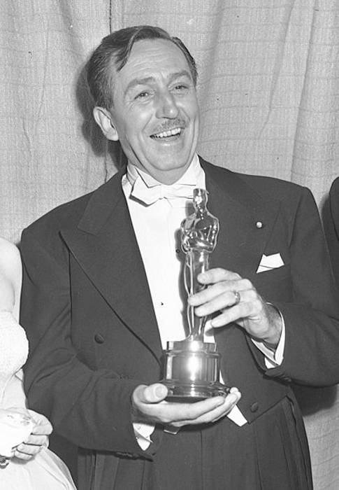 Walt Disney seen holding his Oscar for Water Birds in 1953