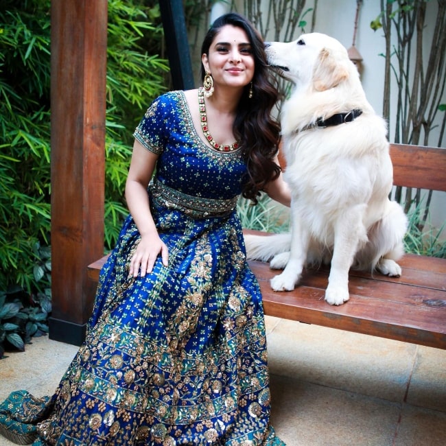 Divya Spandana as seen in a picture with a dog in 2016