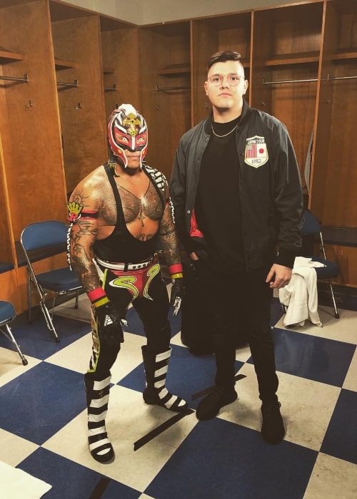 Dominik Mysterio as seen in a picture with his father Rey Mysterio in May 2019, at the Rupp Arena