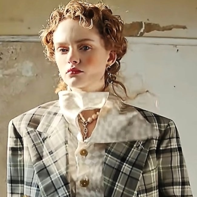 Emma Laird modeling for Vivienne Westwood in 2021