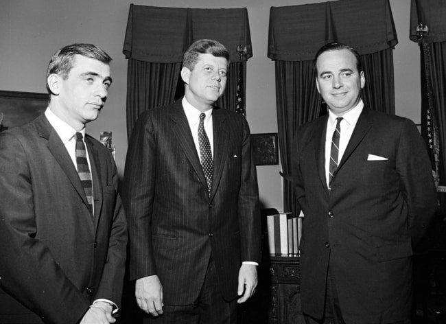 From Left to Right - Zell Rabin, President John F. Kennedy, and Rupert Murdoch posing for a picture in the Oval Office in 1961