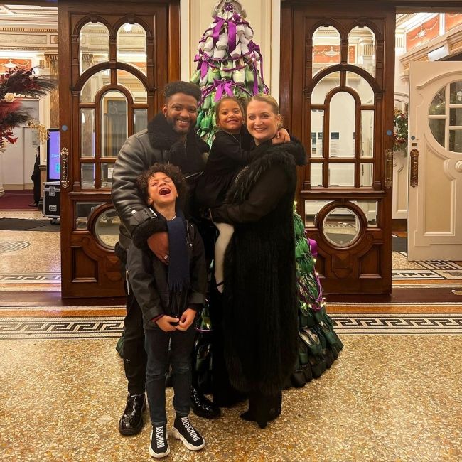 JB Gill as seen with his wife Chloe and children in December 2022