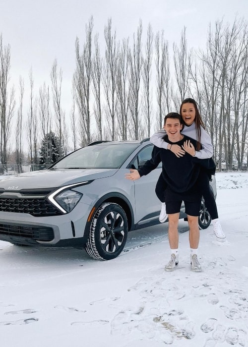 Jessica Baio and her beau Sam Jose in a picture with their new car that was taken in January 2023