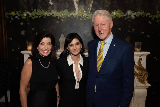 Julia Haart as seen posing alongside former President Bill Clinton an governor Kathy Hochul in October 2022