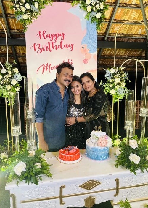 Meenakshi Anoop as seen in a picture with her parents on her birthday in October 2022